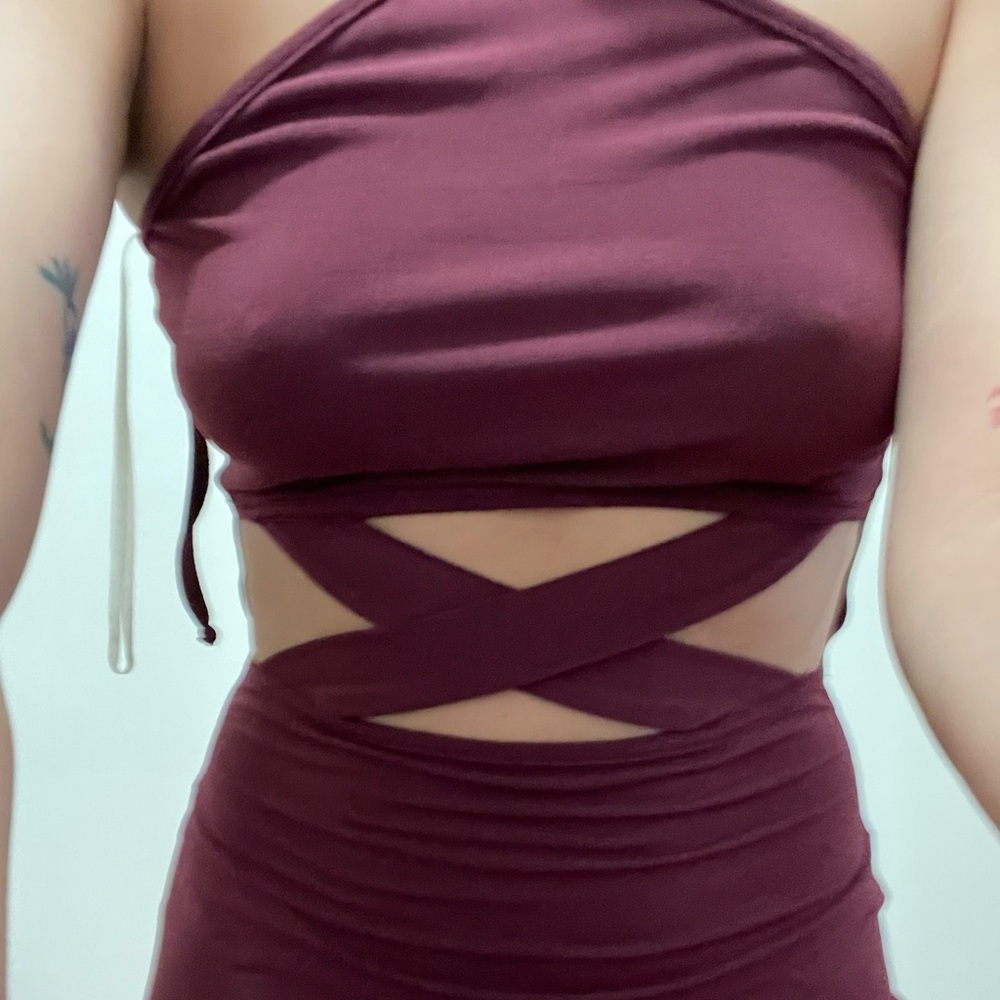 Sexy form fitting midi dress with cross midsection.